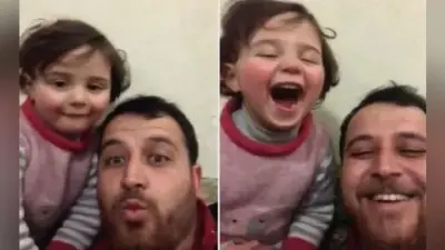 Viral : सीरिया में बम धमाकों की आवाज पर बेटी को खिलखिलाना सिखा रहा यह शख्स, देखें Video
