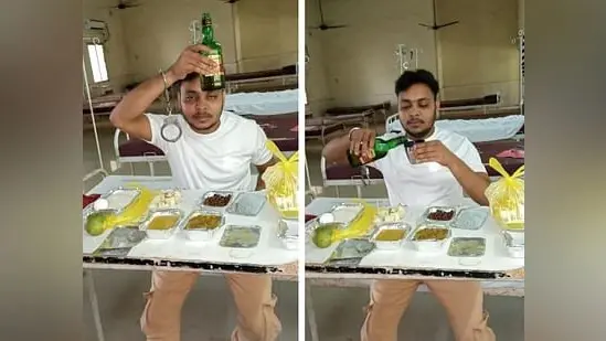 कोविड सेंटर में शराब की बोतल के साथ फोटो वायरल, दो पर केस दर्ज
