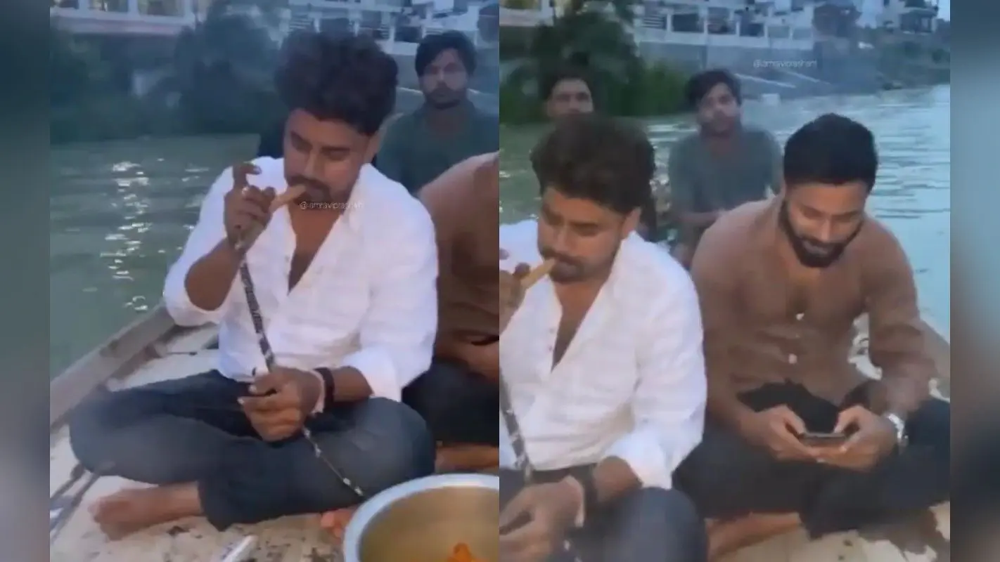 Viral Video: गंगा नदी में चलती नाव पर मांस पकाने और हुक्का पीने का वीडियो वायरल, जांच में जुटी UP पुलिस