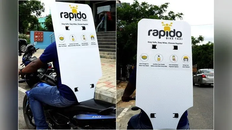 Rapido ने सोशल डिस्टेंसिंग के लिए अपनाया अनोखा तरीका, बाइक पर लगा दी बैक शील्ड