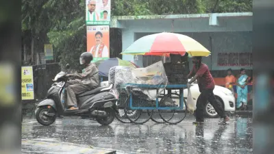 DHANBAD NEWS : पश्चिम बंगाल में बने डीप डिप्रेशन का असर, दिन भर तेज हवा के साथ होती रही बारिश