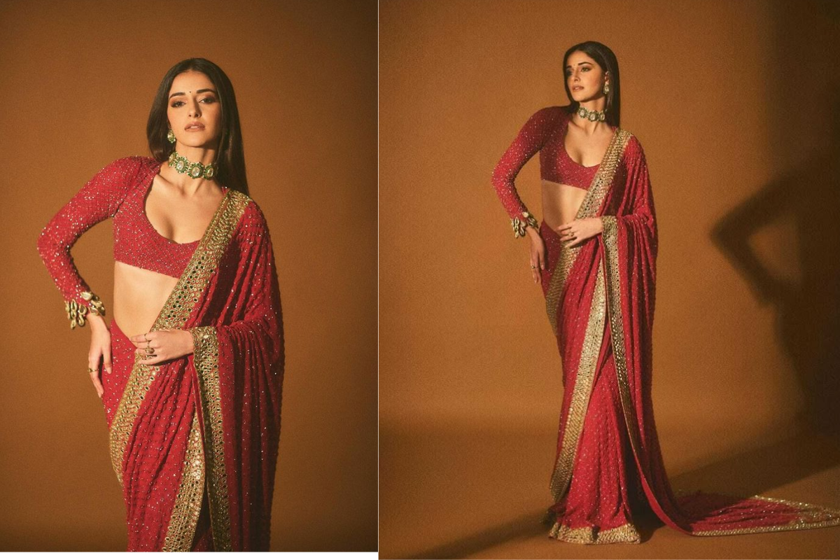 Beautiful woman in saree doing open pallu flow pose for Teej photography photoshoot.
