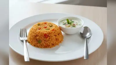 Tomato Pulao Recipe: मिनटों में बनाएं टेस्टी और फ्लेवर से भरपूर टमाटर पुलाव, लंच–डिनर दोनों के लिए परफेक्ट
