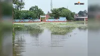मूसलाधार बारिश से तालाब बना सालमारी का कर्बला मैदान, जलजमाव से राहगीर और स्कूली बच्चे बेहाल