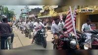 लाल-हरा पाड़ साड़ी, पारंपरिक धोती और हाथों में जागरूकता का संदेश...